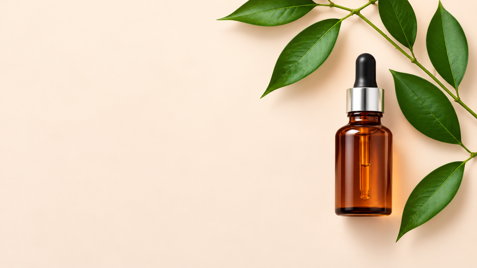 Amber retinol serum bottle with green botanical leaves on a light background